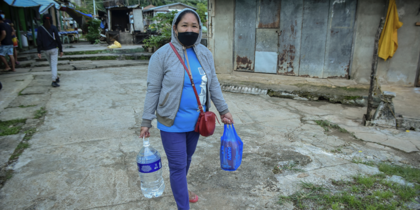 Dolores Basijan bought medicines, mineral water and other stuff after she received an amount of Php 1,800 from the B-Ready project preemptive cash assistance. (Photo: Alren Beronio/Oxfam) Dolores Basijan bought medicines, mineral water and other stuff after she received an amount of Php 1,800 from the B-Ready project preemptive cash assistance. (Photo: Alren Beronio/Oxfam)